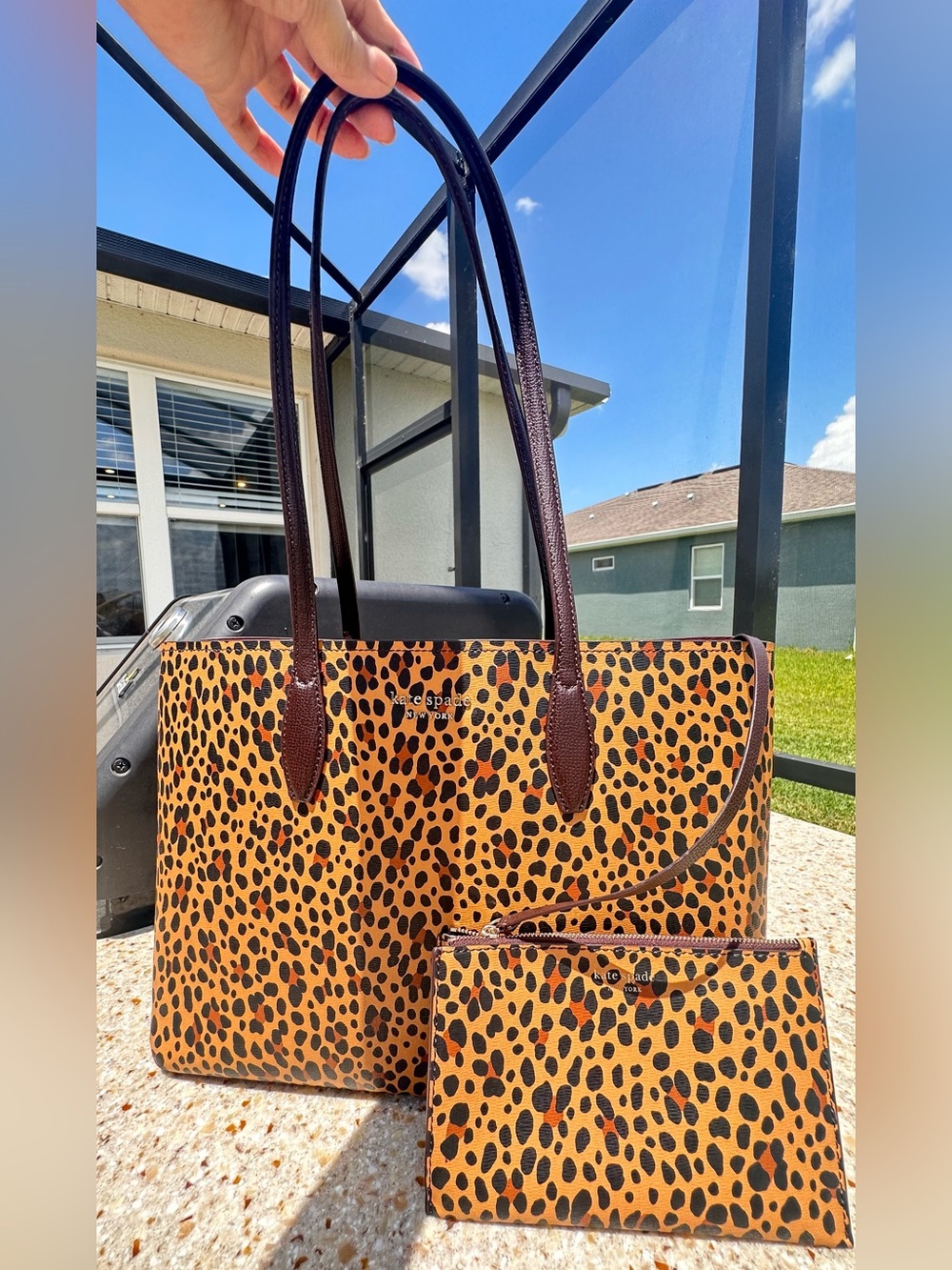 Kate Spade leopard print tote bag with matching pouch.